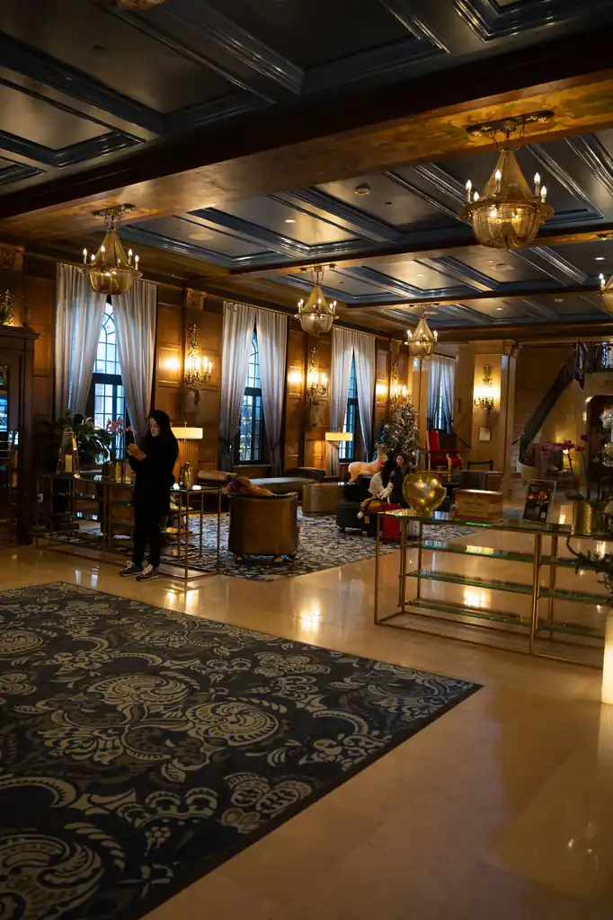 Luxurious Marbletrail Studio lobby with elegant chandeliers and plush seating